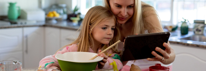 Mother and daughter cooking